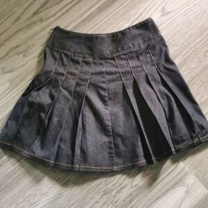 San Francisco mini pleated black denim skirt.